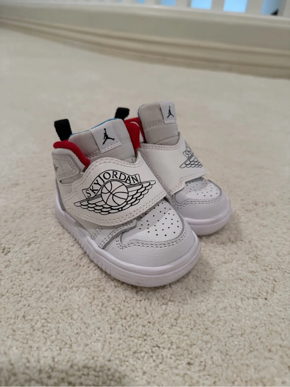 Jordan White toddler Sneakers with Red & Light Blue Accents